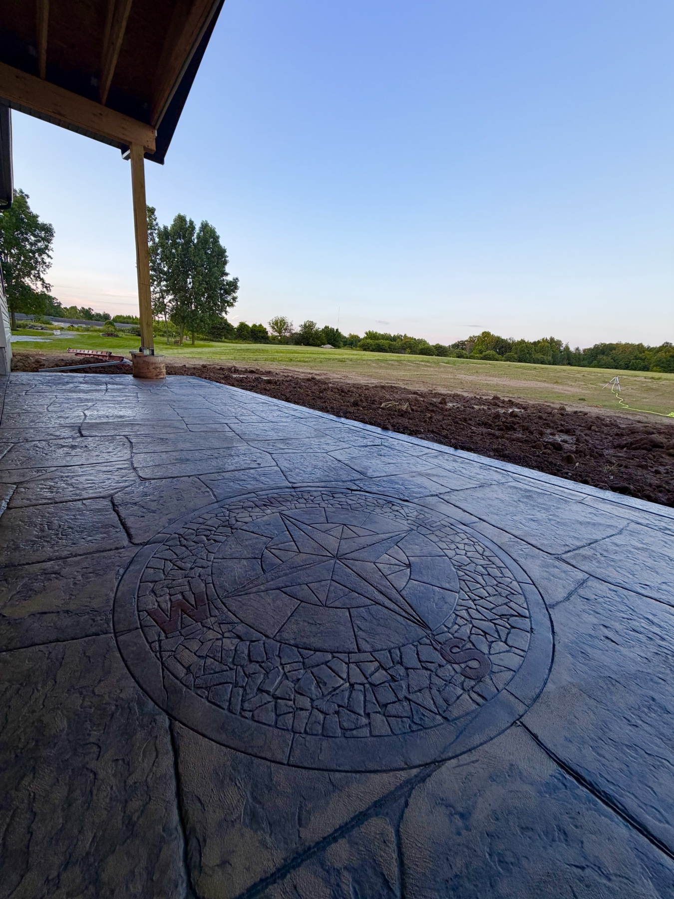 Stamped concrete patio with compass detail